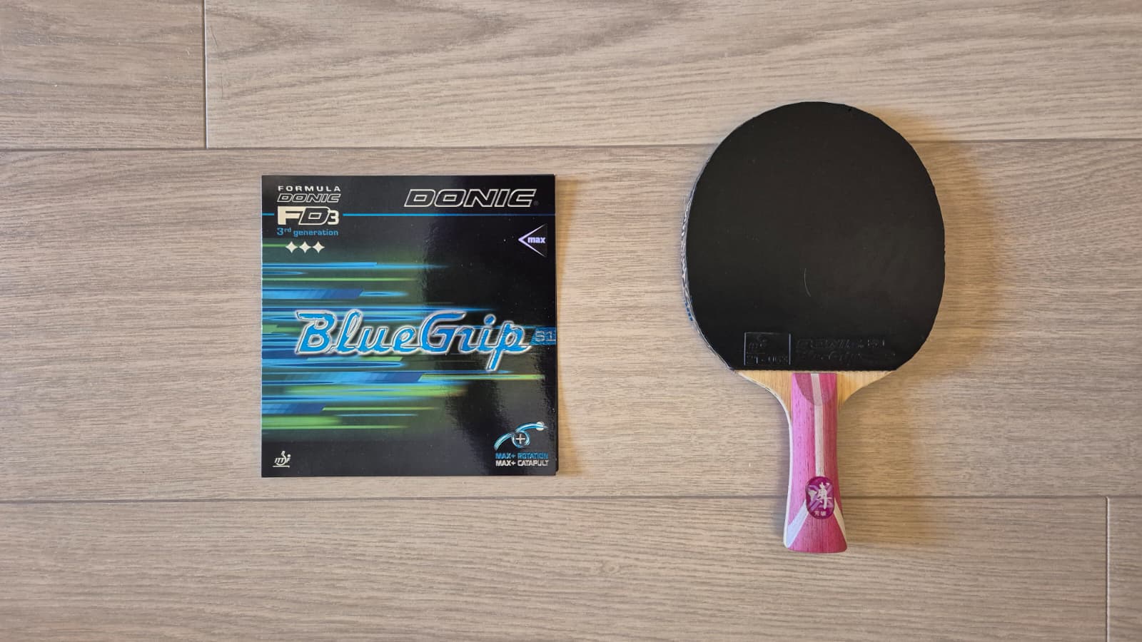Donic BlueGrip S1 rubber packaging next to a DHS Fang Bo B2X blade