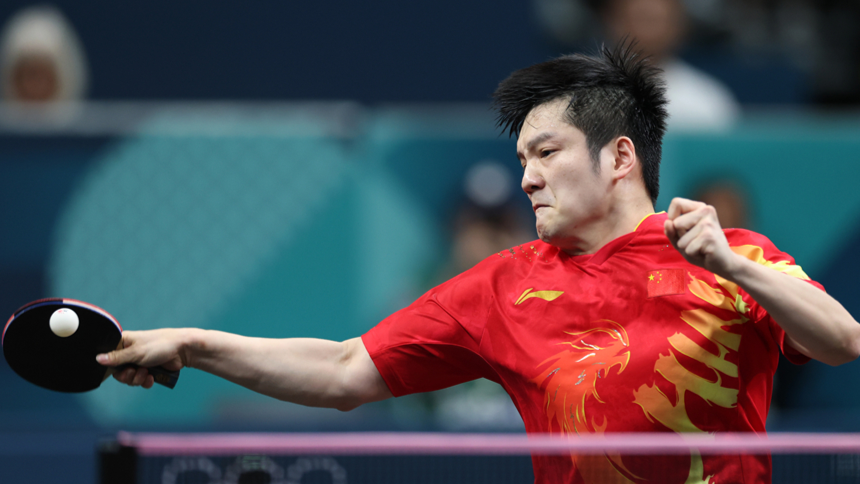 Fan Zhendong demonstrating the open wrist position before a forehand loop